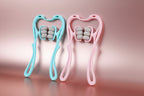 Two handheld massage tools, one blue and one pink, on a light blue background.