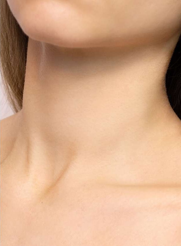 Close-up of a person's neck after used with a blurred background