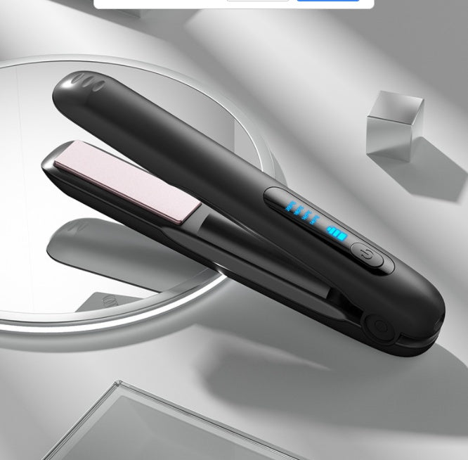 Black hair straightener with digital display on a reflective surface