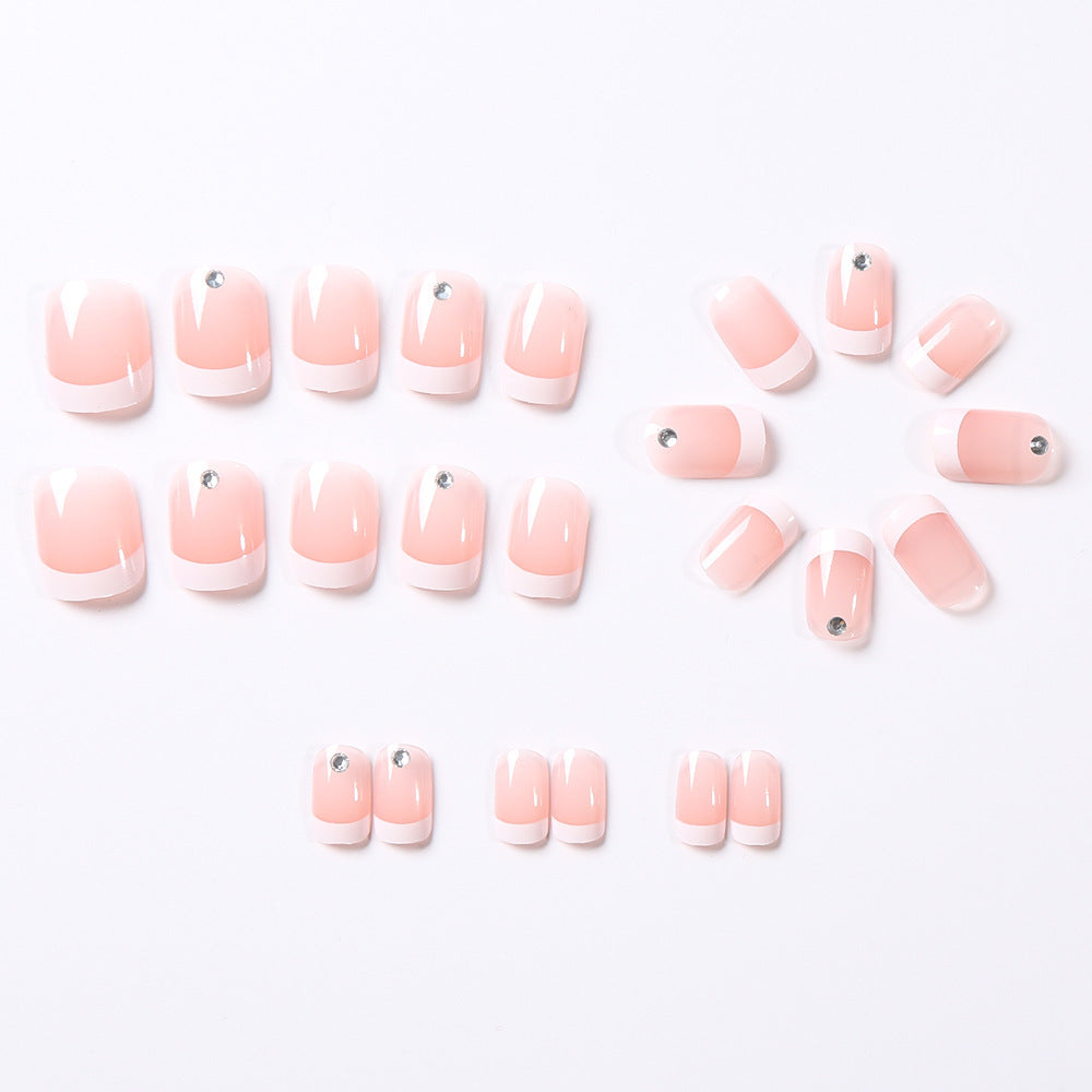 Set of pink nail tips with white tips on a white background