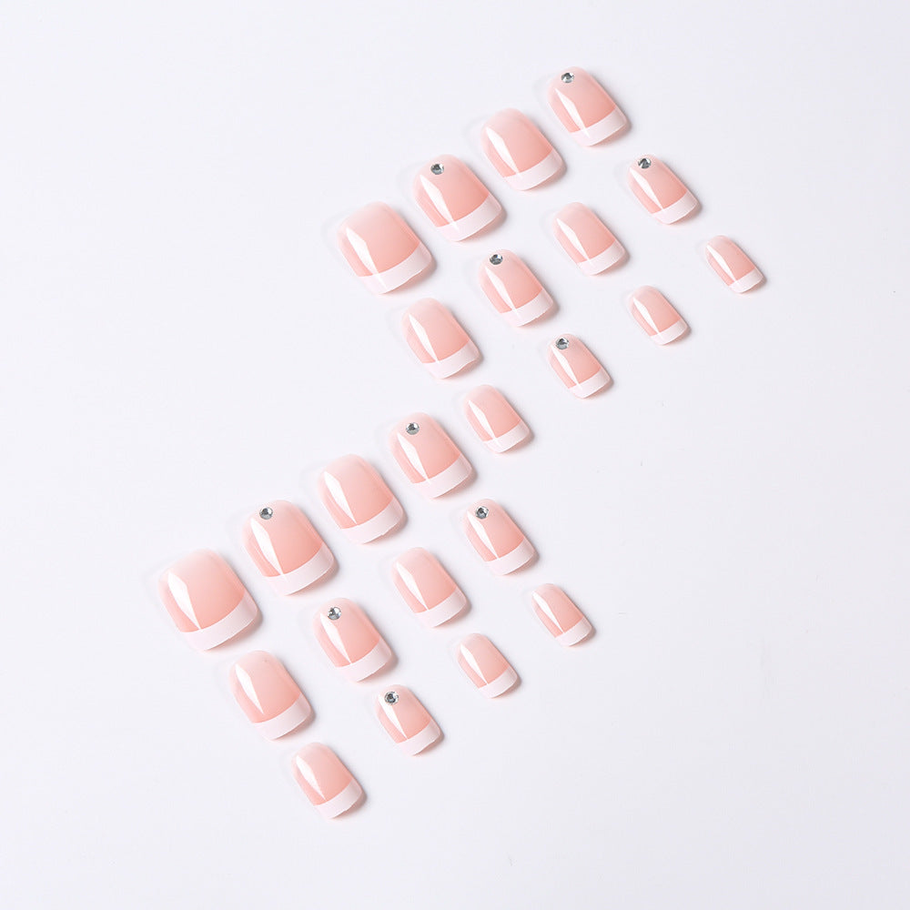 Set of pink nail extensions on a white background