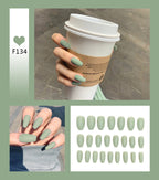 Jade green press-on nails on model finger for every occasions 