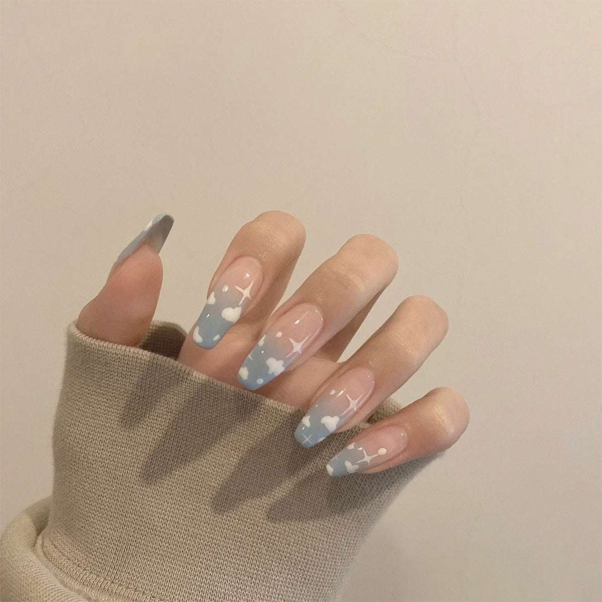 Wearing a cloud and blue press-on Finished Soft Nails False Nails