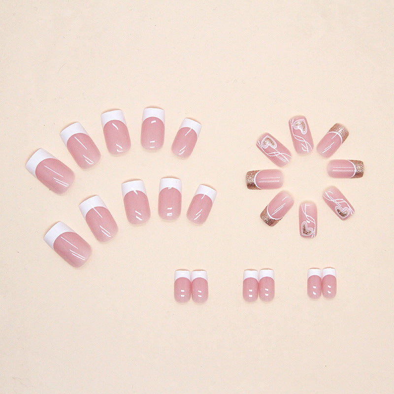 "Pink heart press-on nails displayed in circulation layout."