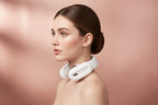 Pink and white intelligent neck and shoulder massager with metal therapy pads