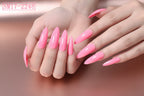 Hand with pink nail polish on a plain background