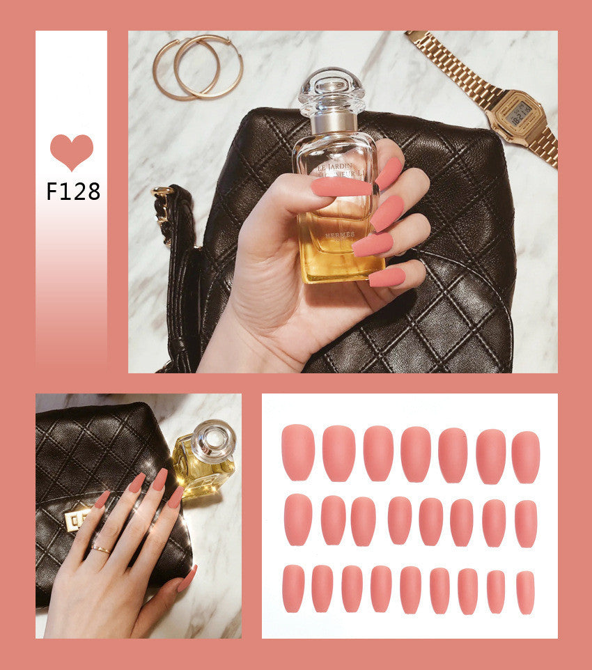 Pink press-on nails nails set close-up view with woman styling 