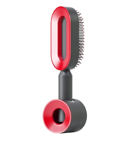 Red and black hair brush on a white background