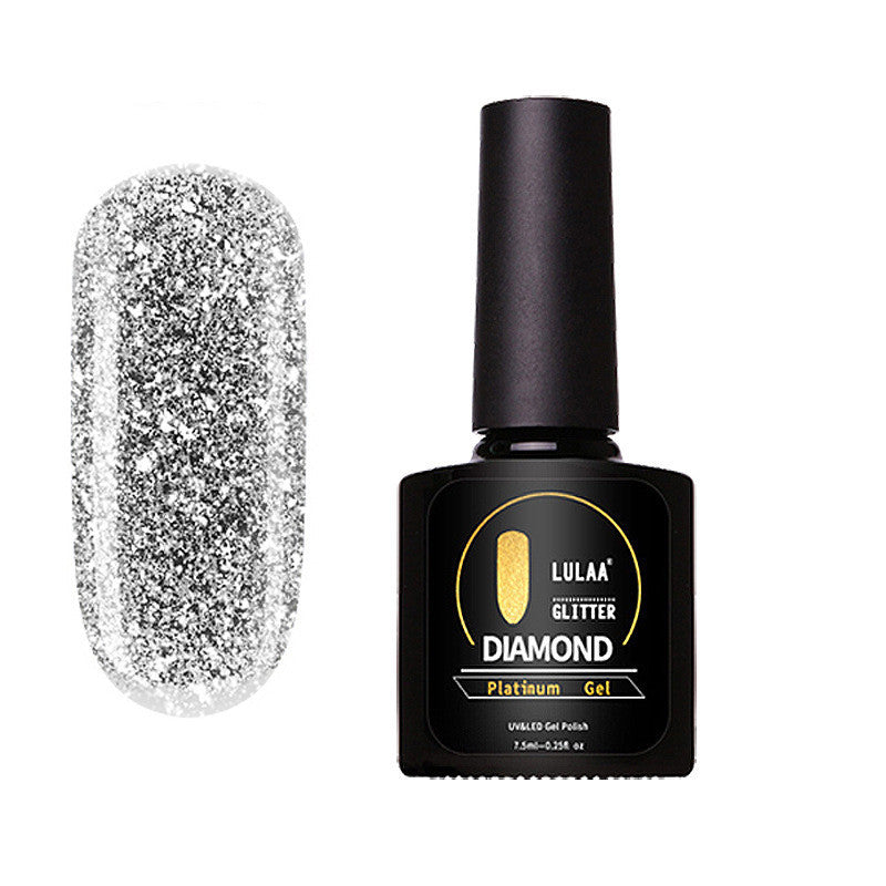 A bottle of Lula brand silver nail polish with a glitter diamond effect, labeled as 'Glitter Diamond'.