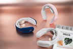 "Neck and shoulder massagers in pink, blue and white colors."
