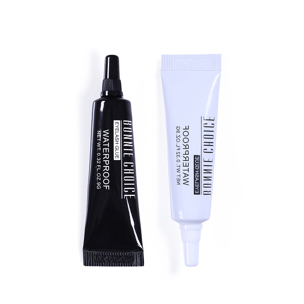 Black and white eyelashes glue tube for eyelashes on a white background 