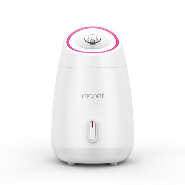 White humidifier with pink accent on a white background