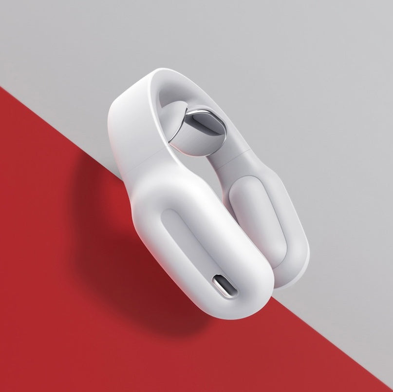 White wireless earbuds in a charging case on a red and gray background