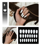 A collection of false nails in a white color, displayed elegant press on nails 