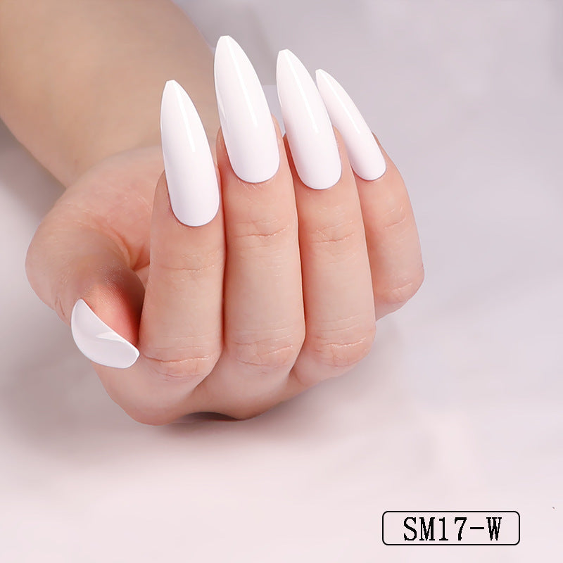 Hand with white nail polish on a plain background