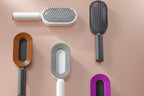 Set of pet grooming brushes in various colors on a beige background